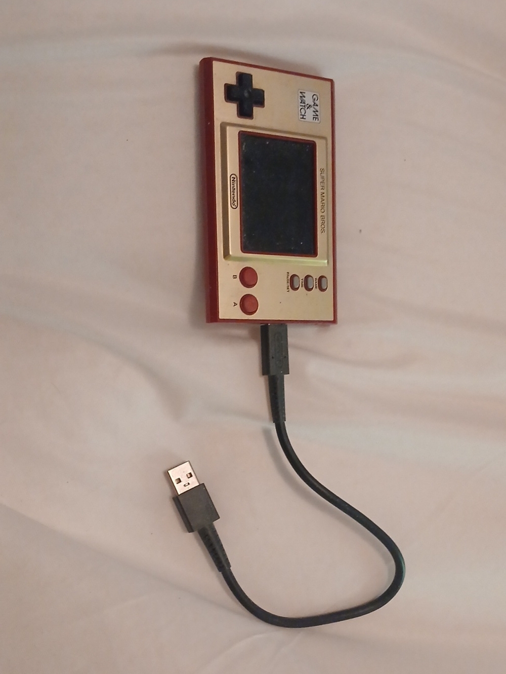 Nintendo Red and Gold Handheld Game Console - Classic Game & Watch Style